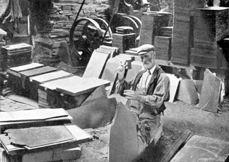 A Quarryman splitting slate