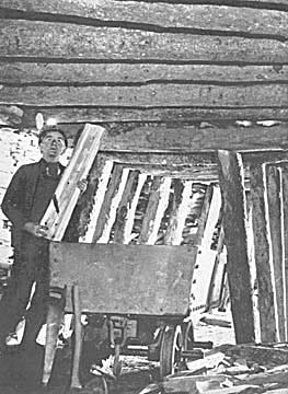 Photograph: Quarryman renewing roof timber, Oakeley Quarry, Blaenau Ffestiniog.