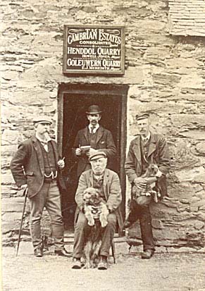 Photograph: Henddol and Goleuwern Quarries' smithy -?? Howell Jones Meredith(seated); Edward Jones Meredith (right) son of above; William Williams, Arthog Terrace, clerk (in doorway); Abel Simner, owner, (left)