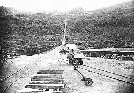 Photograph: The incline at Craig Ddu Quarry and a trolley loaded with a slate block.