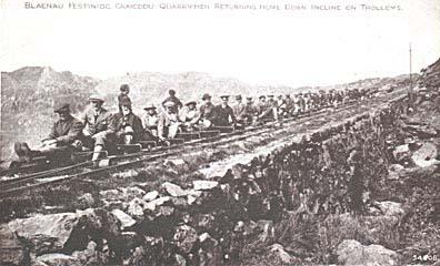 Photograph: Craig Ddu, Blaenau Ffestiniog, quarrymen returning home down the incline on trolleys.