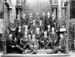Description The Bethesda Choir which toured the country during 1900-03 strike, with the treasurer, Mr Jeremiah Thomas, holding the bag in which the takings were carried.
