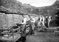 Quarrymen loading slates on to wagons for delivery to Y Felinheli