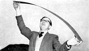 Mr D. Jones of Oakeley Quarry showing the flexibility of slate, 1958.