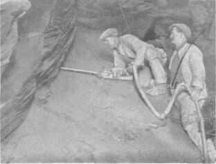 Quarrymen drilling underground.